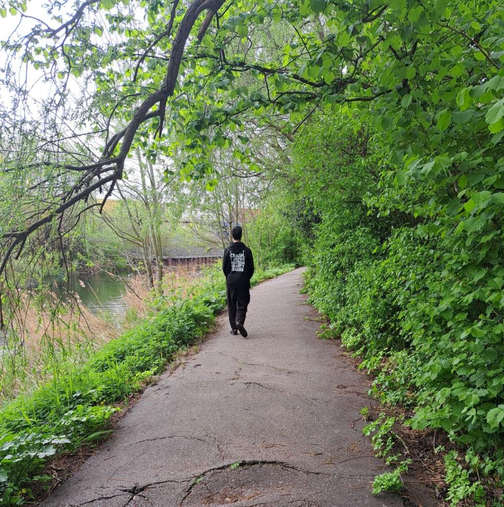 Young Person walking along a tow path