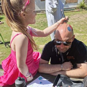 A Young YP creating Tattoos on staffs head!